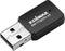 Un adaptateur USB Wi-Fi noir d'Edimax, modèle EW-7722UTn V3, est posé sur une surface blanche.