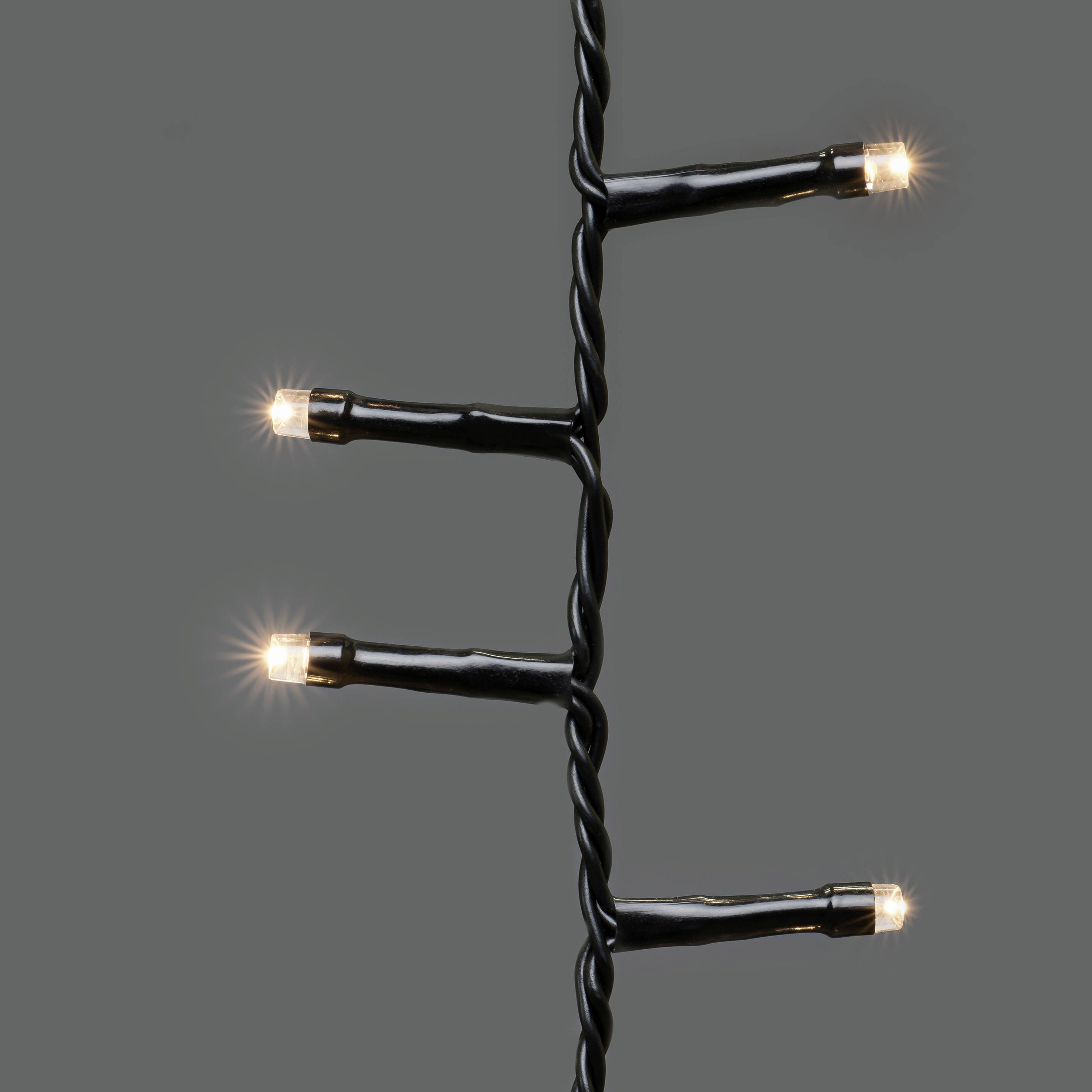 Guirlande lumineuse sur un fond gris, montrant trois LED illuminées.