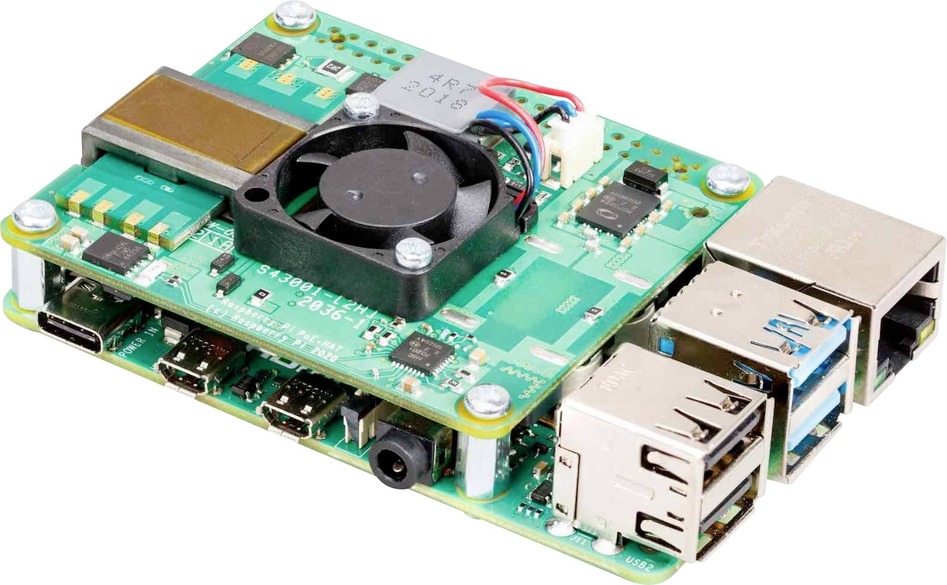 Une carte Raspberry Pi verte avec plusieurs ports USB, une connexion Ethernet et un petit ventilateur sur le dessus.