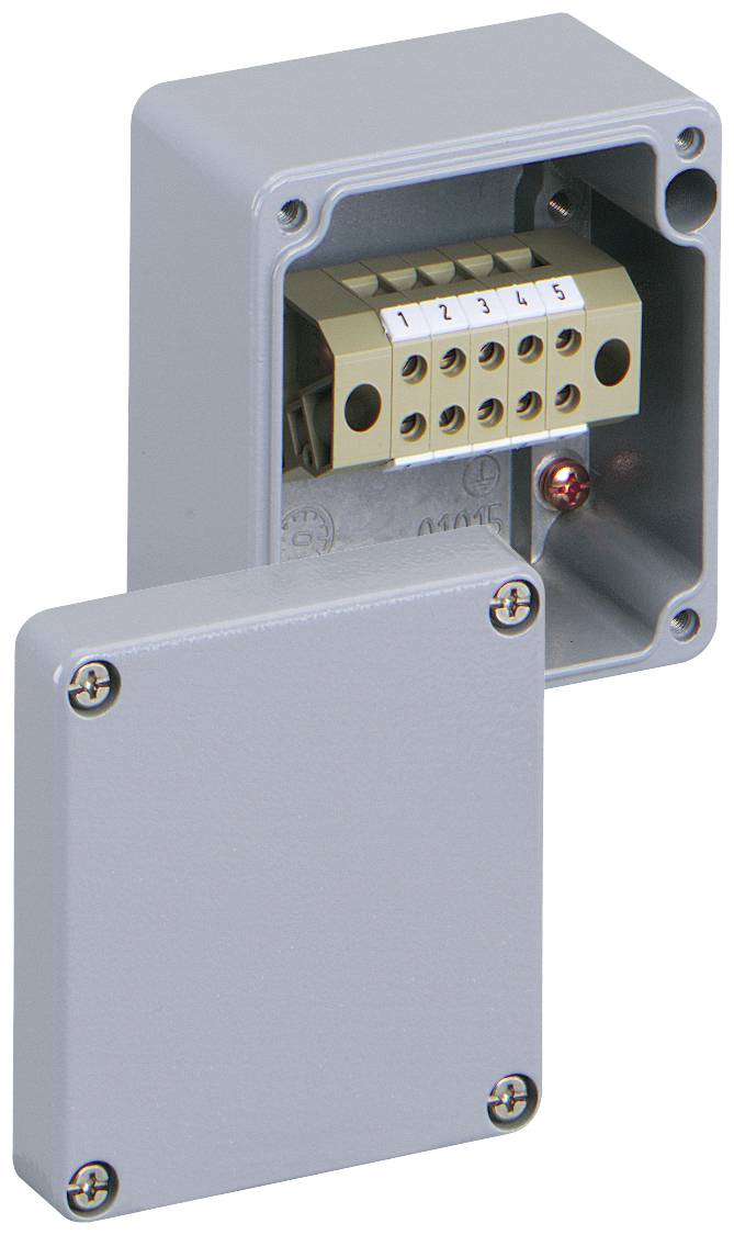 Une prise grise avec son couvercle retiré, montrant un système de bornes à six emplacements.