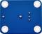 Objet rectangulaire bleu avec quatre anneaux lumineux dans les coins et plusieurs reliefs au centre, sur une surface texturée.