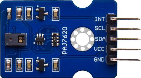 Carte de capteur portant l'inscription 'PAJ7620', montrant plusieurs composants électroniques et connexions (INT, SCL, SDA, VCC, GND) sur un PCB bleu.