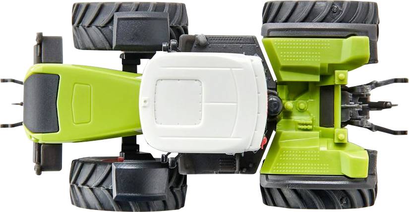 Un tracteur jouet vert vu de dessus, avec de grandes roues noires et une cabine blanche, sur un fond blanc.