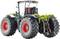 Un tracteur miniature avec de grandes roues rouges et un châssis vert présente en détail les machines agricoles.