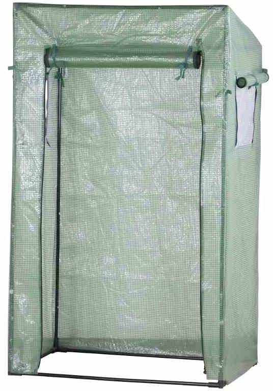 Serre de jardin verte en plastique avec revêtement transparent et porte enroulable. Adaptée aux petits projets de culture de plantes.