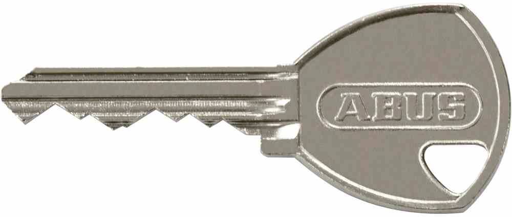 Une clé argentée aux bords dentelés portant l'inscription 'ABUS' sur une tête ronde.
