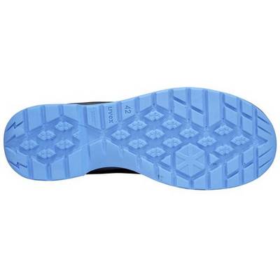 La semelle bleue d'une chaussure avec un profil antidérapant composé de motifs hexagonaux et en losange.