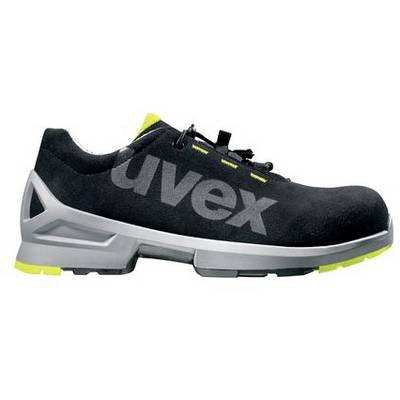 Chaussure de sécurité noire avec logo gris et détails jaunes, résistante aux coupures et conçue pour les interventions de travail.