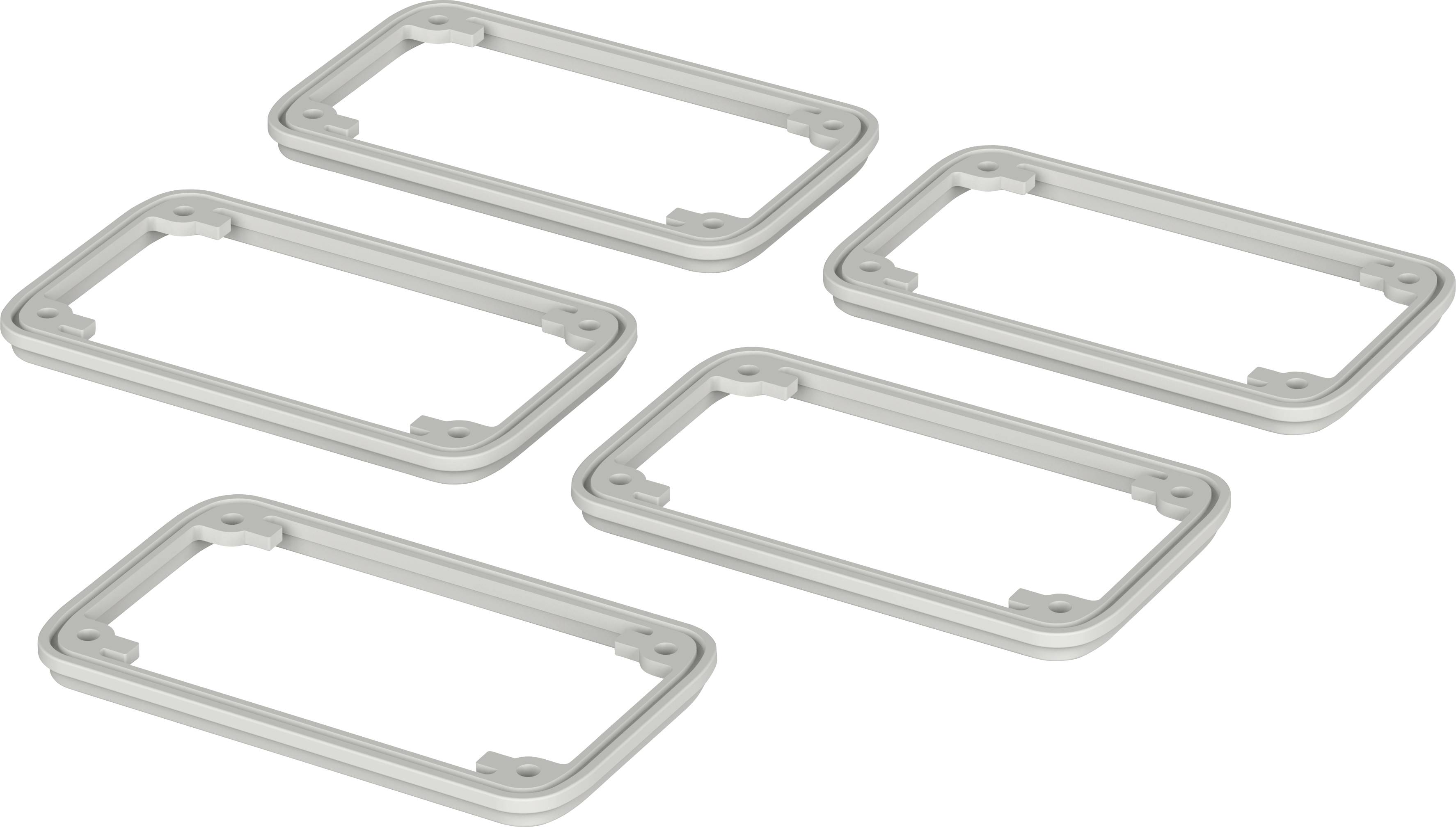 Cinq cadres rectangulaires gris sont disposés à plat sur une surface blanche.