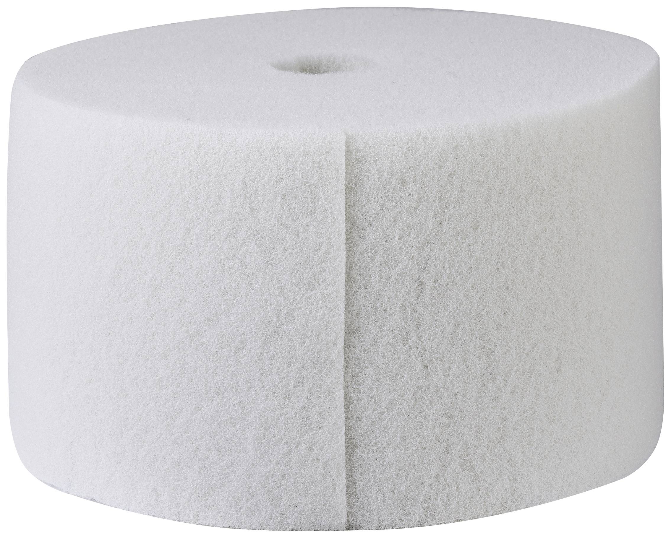 Un grand bloc cylindrique de mousse blanche avec une cavité centrale, utilisé à des fins industrielles ou artisanales.