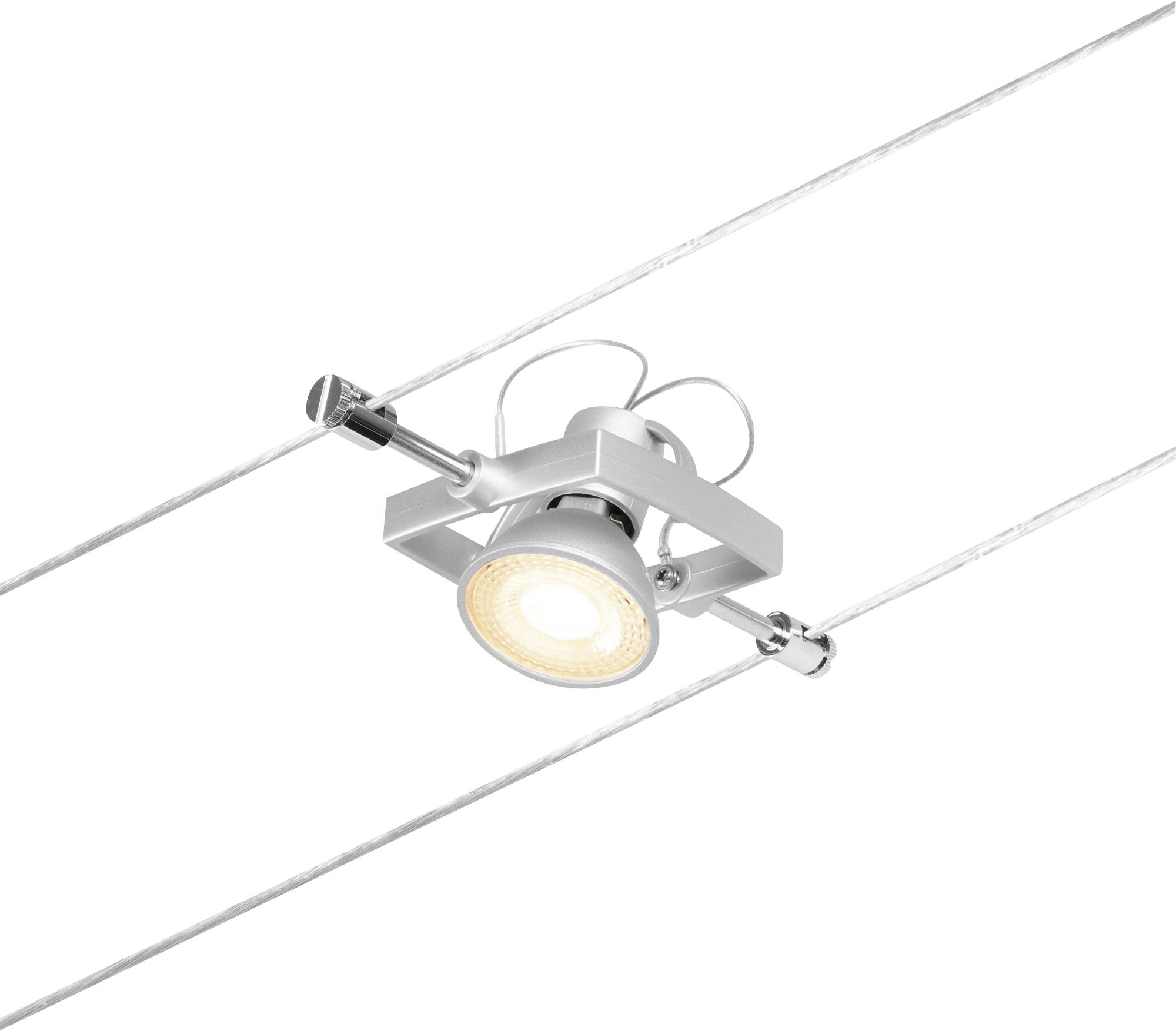 Un projecteur argenté unique sur système de câbles, illuminant l'espace d'une lumière chaude, adapté à un aménagement minimaliste.