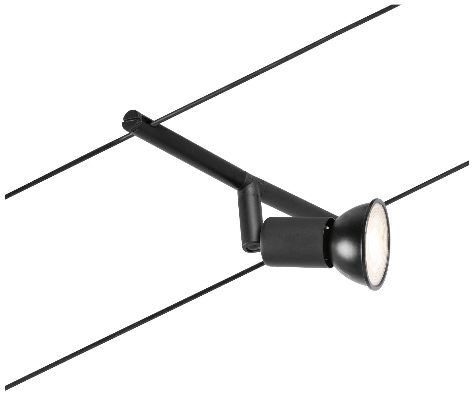 Un projecteur noir est monté sur un système de câbles, positionné pour projeter une lumière ciblée.