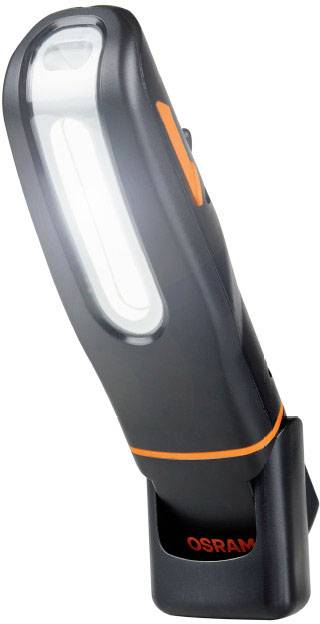 Lampe LED portable noire avec des accents orange, posée sur sa station de charge. Idéale pour les ateliers ou comme éclairage de travail.