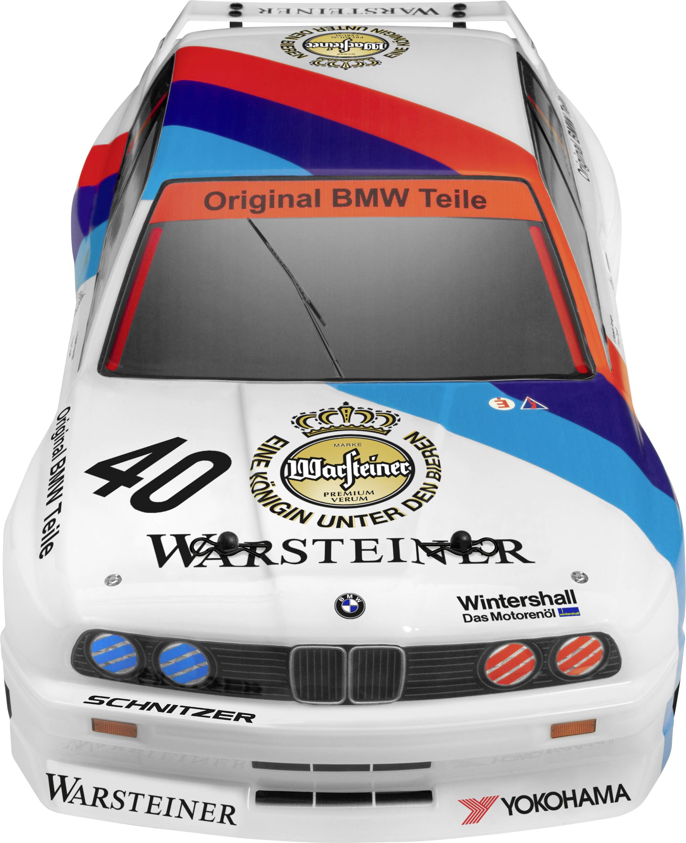 Voiture de course BMW vue de dessus avec publicité 'Warsteiner' et 'Pièces BMW Origine', numéro de course 40, carrosserie blanche avec des accents bleus et rouges.