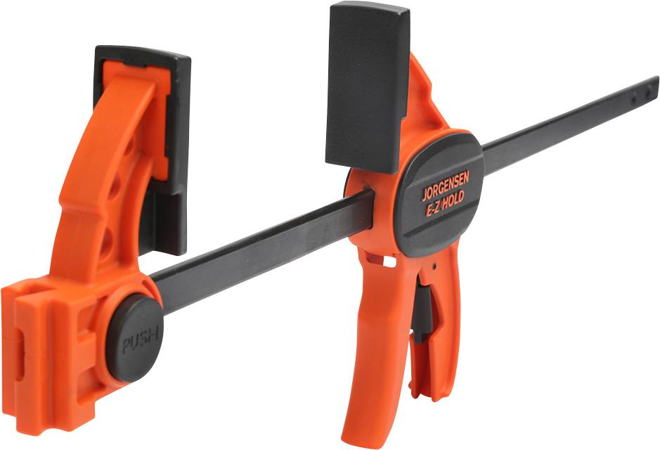 Une pince-étau rapide orange avec une poignée et un levier noirs, adaptée aux travaux de menuiserie.