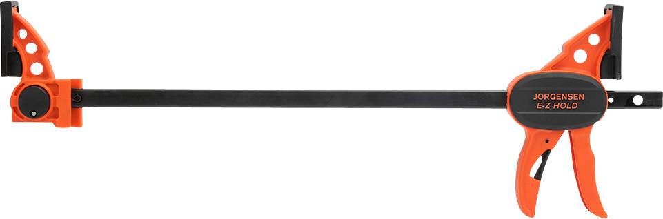 Une serre-joint orange de la marque 'Jorgensen EZ Hold', orientée horizontalement, avec une poignée noire et un mécanisme de réglage.