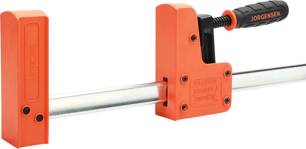 Une pince à vis orange de la marque Jorgensen, utilisée pour maintenir des pièces en place, avec une poignée noire et une tige métallique.