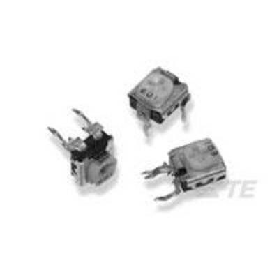 Trois petits composants électroniques carrés avec des connexions métalliques, reposant sur une surface claire.