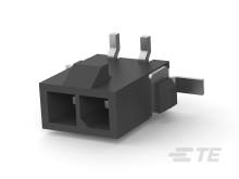 Prise électrique noire avec deux bornes et trois broches métalliques, couramment utilisée pour les connexions dans les appareils électroniques.