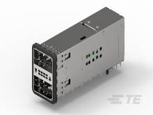 Un module électrique gris avec plusieurs prises et des indicateurs verts sur le côté.