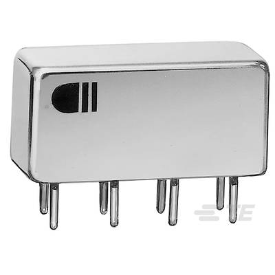 L'image montre un composant électronique rectangulaire métallique avec plusieurs broches à sa base, probablement un oscillateur à quartz.