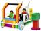 Une voiture colorée construite en briques LEGO, avec deux personnages à l'avant. La voiture a des roues et des pierres décoratives en forme de fleurs.