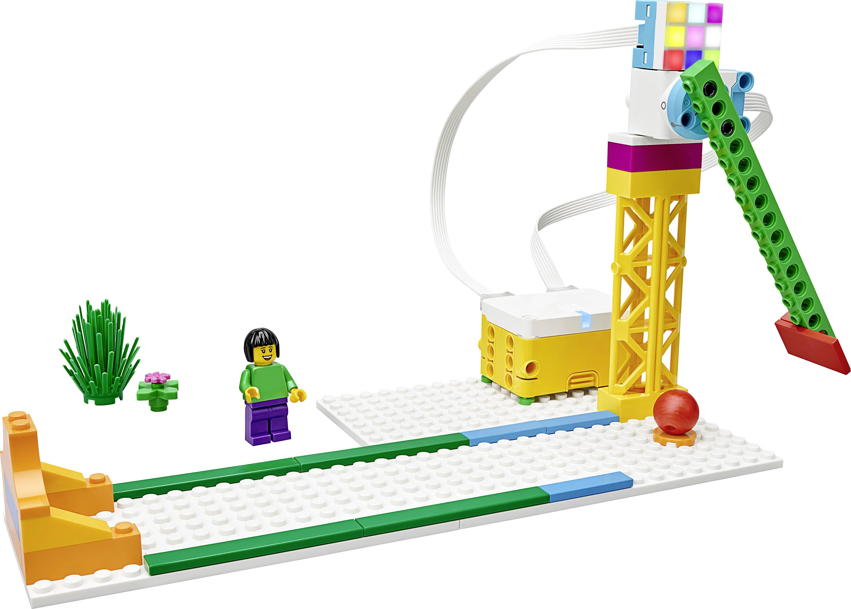 Ensemble LEGO avec figurine, rampes et bille, illustrant des concepts physiques tels que le mouvement et la vitesse, idéal pour un jeu créatif.