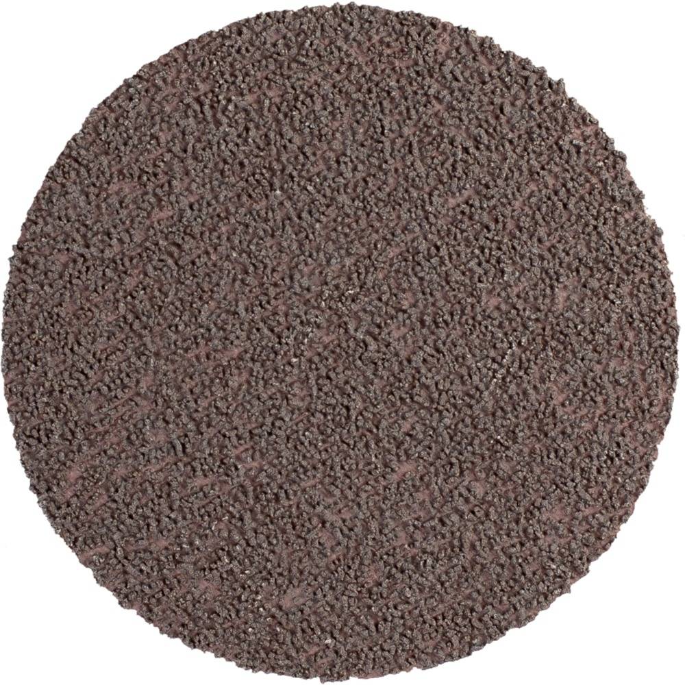 Une meule circulaire de couleur brune à surface rugueuse et granuleuse.