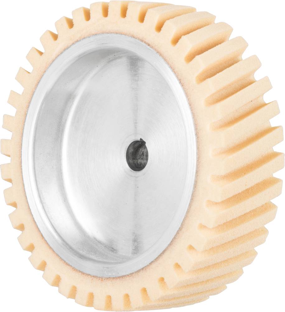 Une roue en mousse avec un centre métallique et un bord cannelé. Utilisée comme outil de ponçage de surface ou aide au polissage.