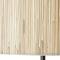 Gros plan sur une lampe en bois de couleur marron clair, structurée avec des lignes verticales, révélant un design naturel et minimaliste.