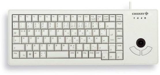 Clavier d'ordinateur blanc avec lettres cyrilliques et latines. Un trackball est situé à droite pour la navigation.