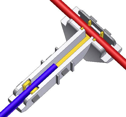 Coupe transversale d'une connexion de câble avec un câble bleu et un câble rouge passant à travers un connecteur rectangulaire.