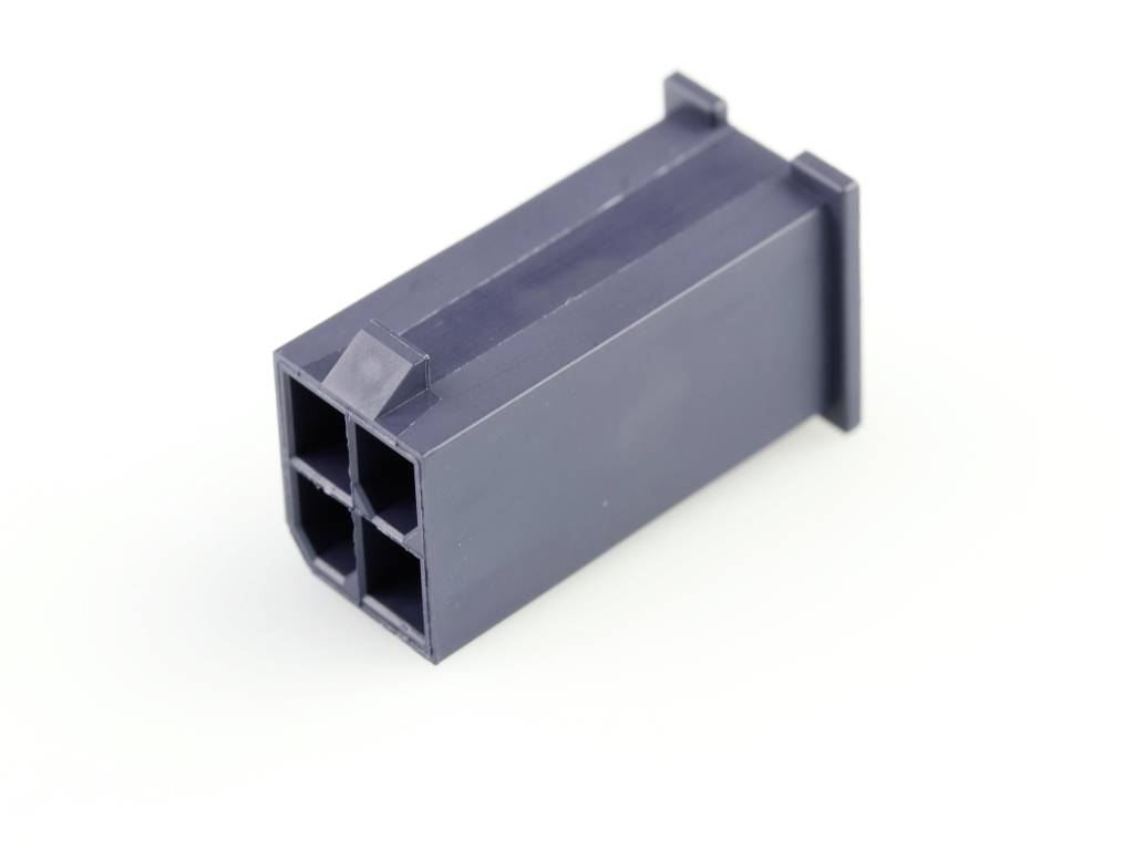 Fiche grise en plastique avec quatre ouvertures rectangulaires, posée sur une surface blanche.