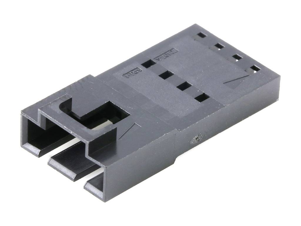 Connecteur en plastique noir, rectangulaire, à trois broches, avec marquages et encoches pour câblage électrique, vue de dessus.