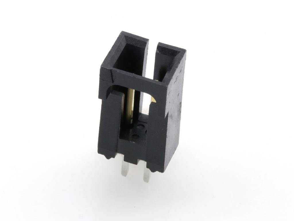 Un connecteur noir en plastique avec deux broches métalliques, utilisé pour la connexion électrique sur une carte de circuit imprimé.