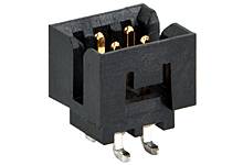 Connecteur rectangulaire noir avec quatre contacts dorés, adapté aux connexions électriques dans les appareils électroniques.