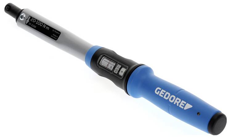 Une clé dynamométrique avec une poignée bleue, étiquetée 'GEDORE', présente un affichage indiquant des réglages de couple allant de 20 à 100 Nm.