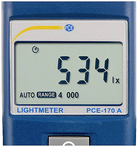 Affichage d'un luxmètre numérique indiquant '534 lx' sur l'écran. En bas est inscrit 'LIGHTMETER PCE-170 A' et l'affichage est réglé sur 'AUTO RANGE 4000'.