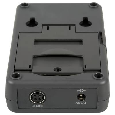 Socle/adaptateur de dispositif électronique noir avec trous de montage, connecteur d'entrée circulaire et prise d'alimentation CC 9V sur fond blanc.