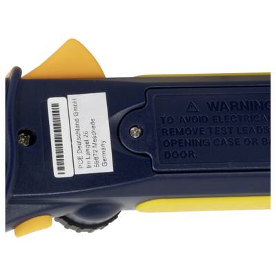 Gros plan d'un testeur portatif bleu avec un panneau d'avertissement et une étiquette du fabricant, affichant du texte d'adresse allemande et un code-barres.