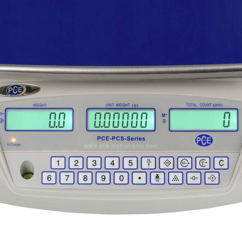 Balance numérique avec clavier et affichage pour le poids, le nombre et l'unité. L'écran affiche '0,0' pour le poids et la quantité.