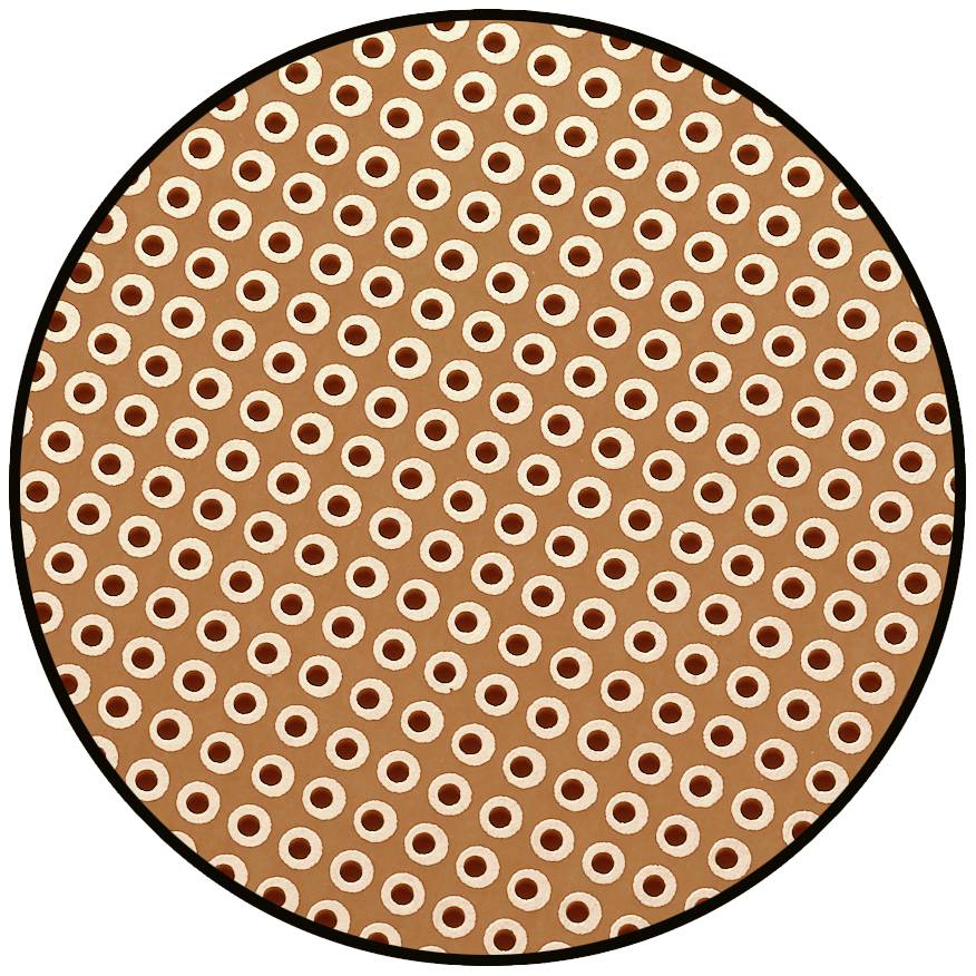 Motif circulaire avec des points brun clair et blancs sur un fond brun foncé.