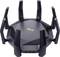 Routeur Wi-Fi noir avec huit antennes déployées sur un fond blanc. Logo du fabricant visible en haut de l'image.
