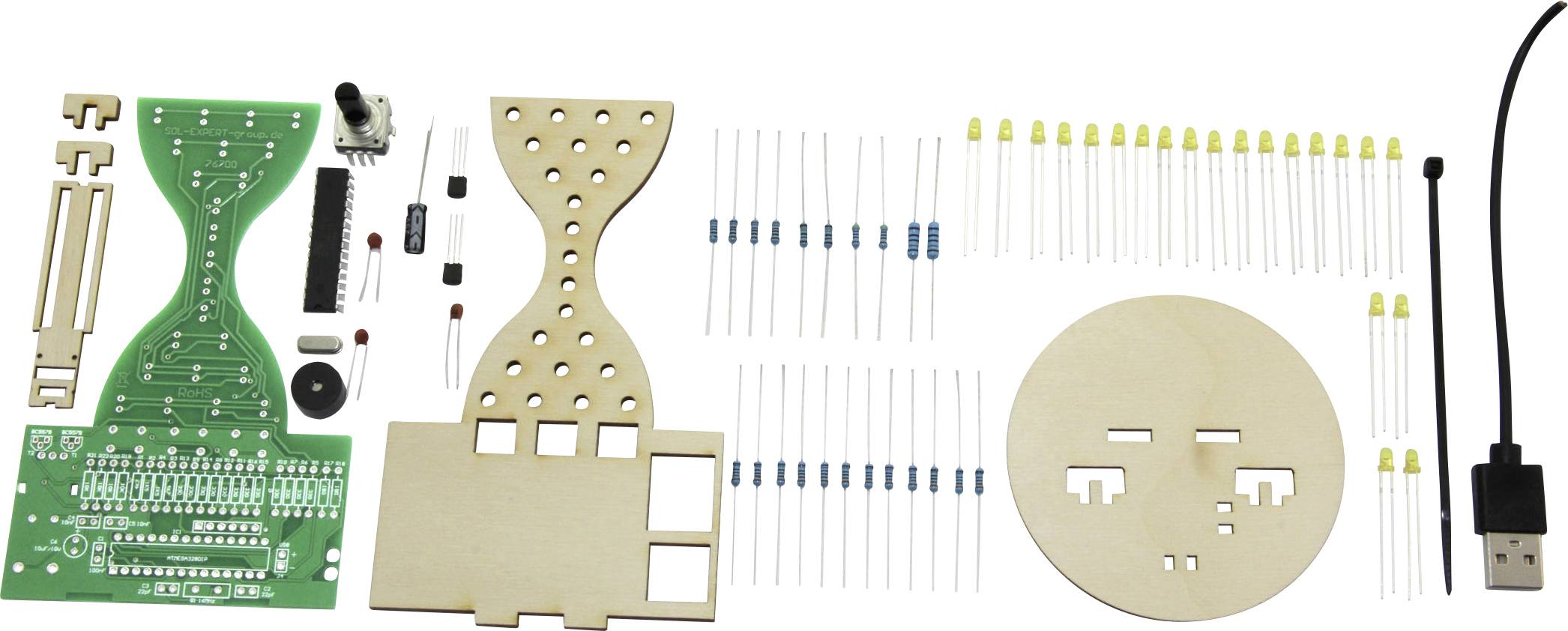 Kit électronique avec circuit imprimé, résistances, transistors, LED et cadre en bois. Contient des composants pour souder et assembler un projet.