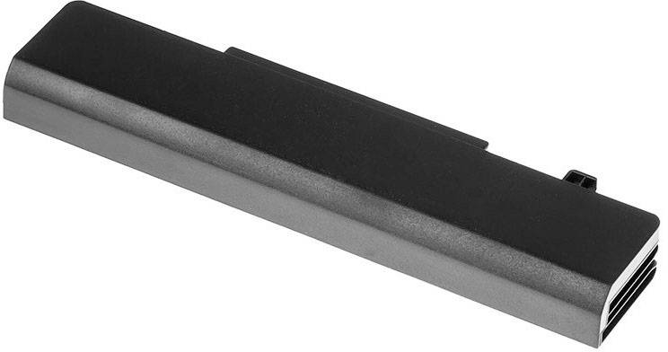 Une batterie de portable rectangulaire, noire, à surface lisse, avec un connecteur sur l'un de ses côtés étroits.