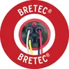 Logo 'BRETEC' avec des câbles colorés dans un disque rouge rond. Quatre câbles de différentes couleurs convergent vers un point de connexion central.