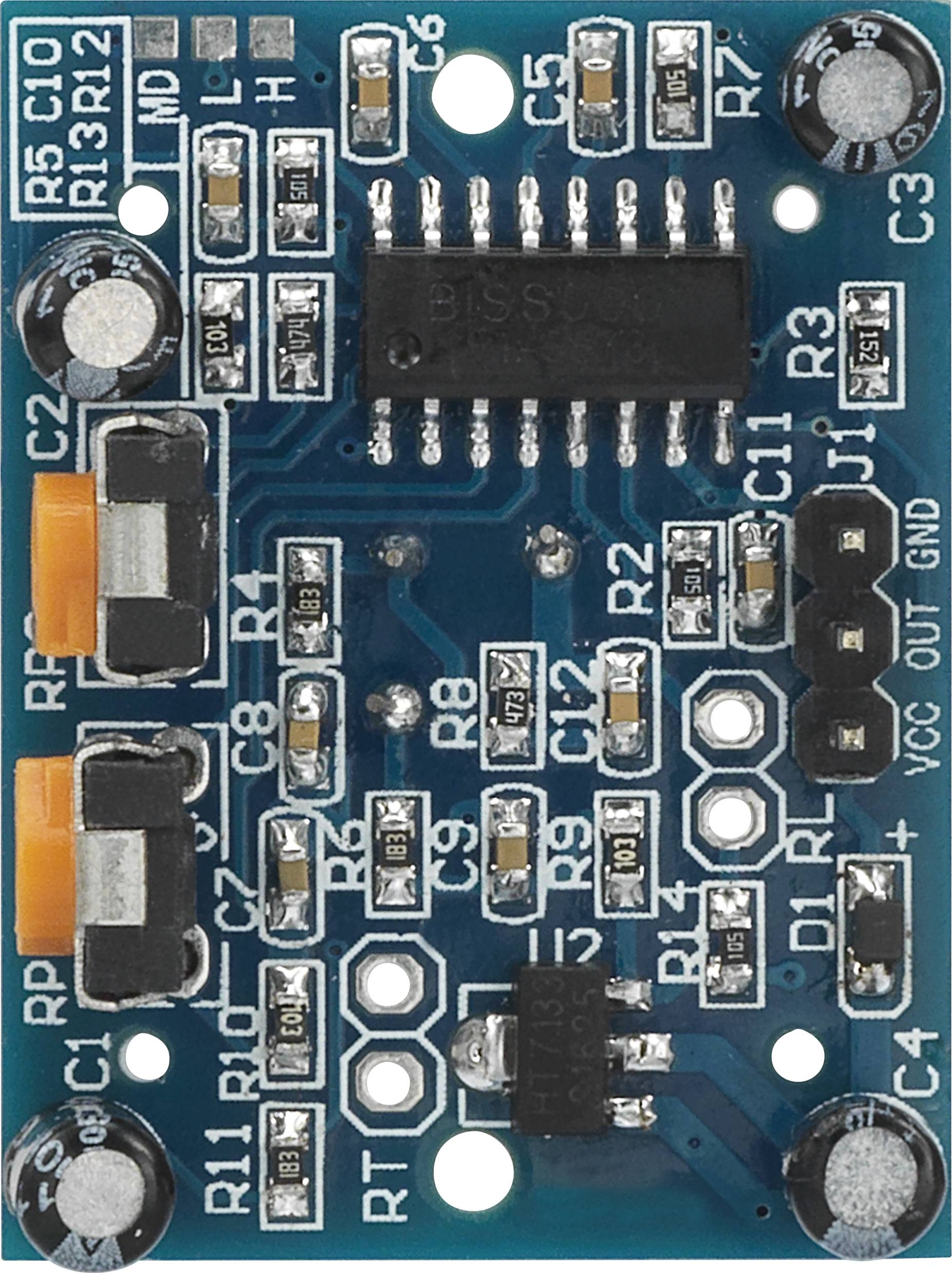 Circuit électronique sur une carte de circuit imprimé bleue, contenant divers résistances, condensateurs et circuits intégrés.