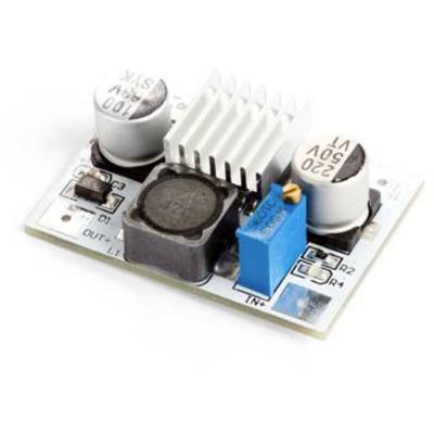 Un petit module électronique rectangulaire avec deux condensateurs ronds, une bobine et un potentiomètre bleu sur une carte de circuit imprimé.