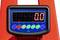 Balance numérique avec boîtier rouge et affichage LED indiquant '0.0'. Interface utilisateur avec touches pour des fonctions telles que Hold, Total et Zéro.