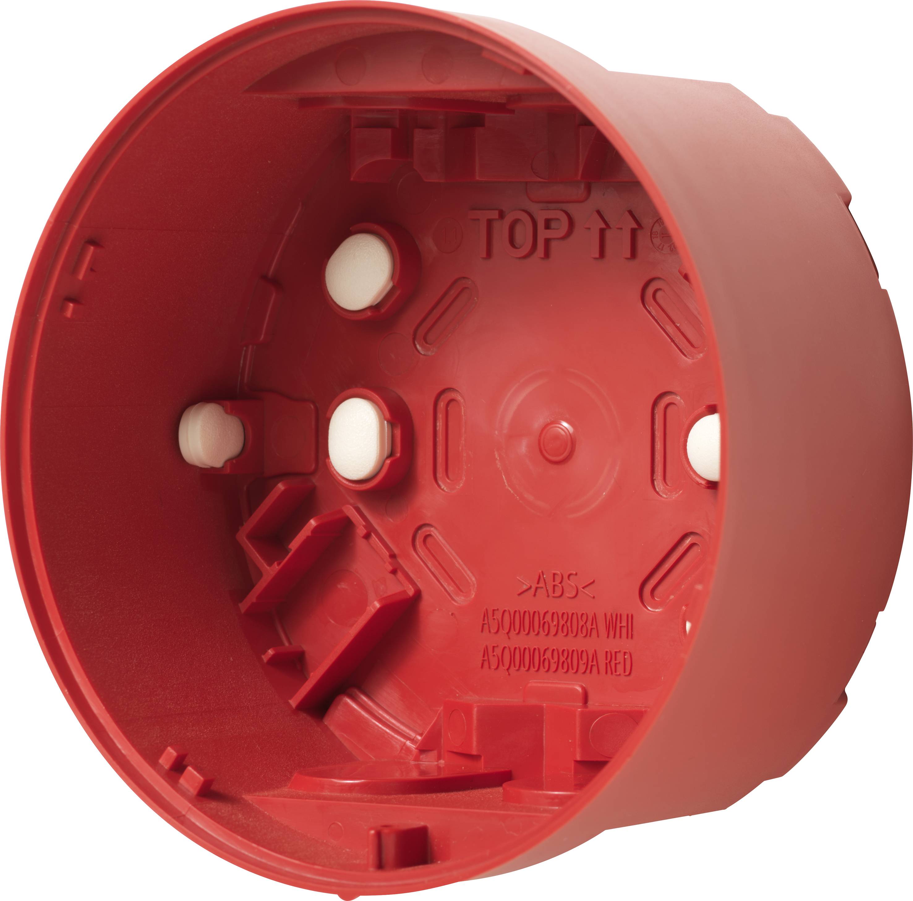Boîte en plastique rouge, ronde, avec plusieurs ouvertures et inscriptions à l'intérieur, utilisée pour le montage de composants électriques.
